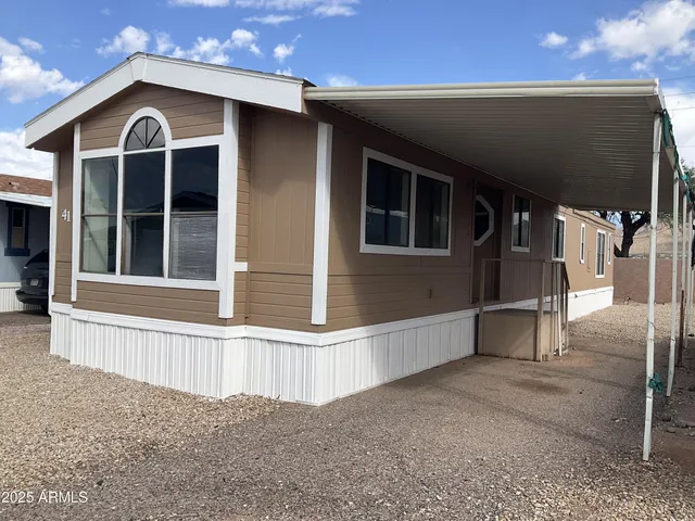a view of a house with a yard and garage