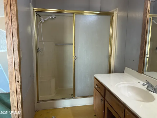 a bathroom with a sink and shower