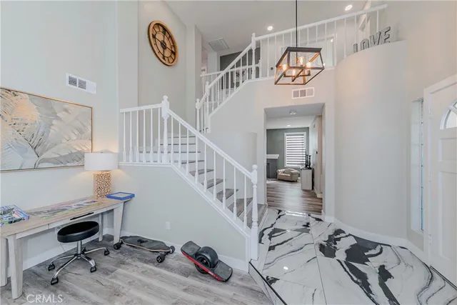 a kitchen with stainless steel appliances a refrigerator sink and stove