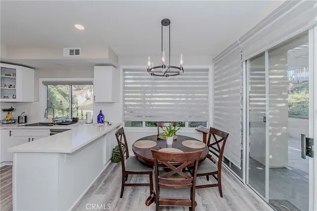 a kitchen with a sink a stove and cabinets