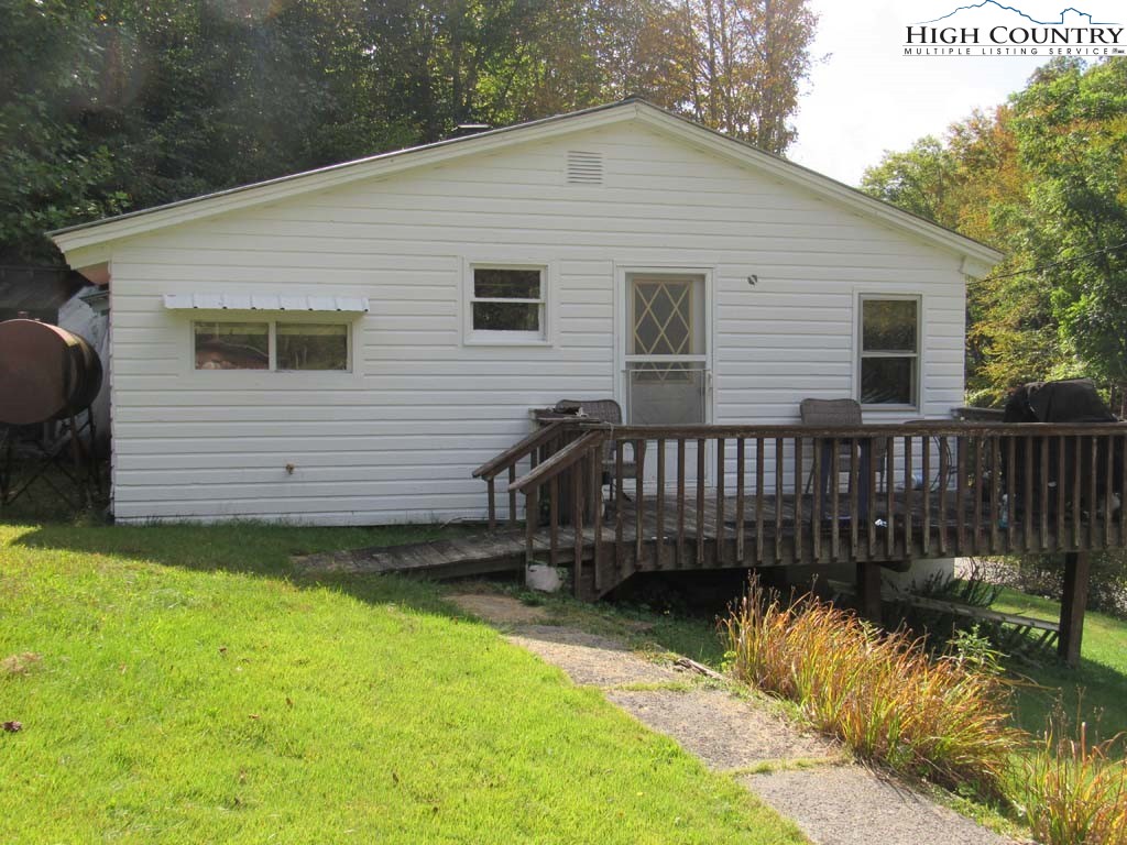 458 Paul Goodman Road Fleetwood, NC 28626 - Photo 1 of 22 a view of a house with a yard and furniture