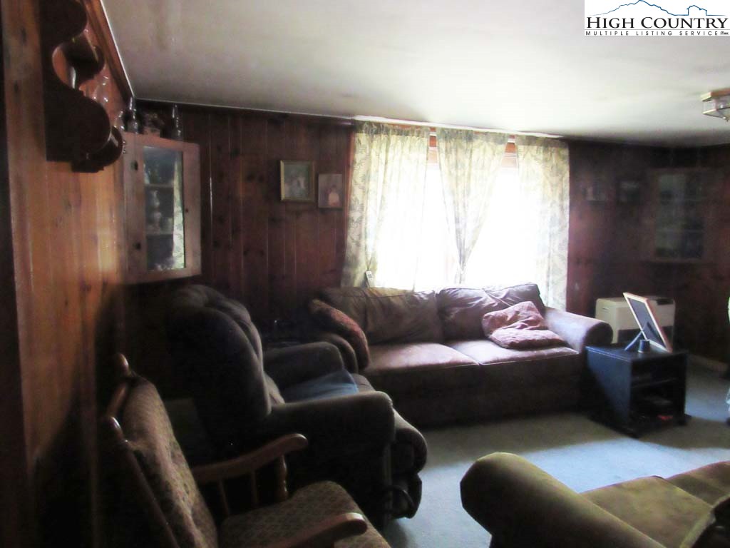 458 Paul Goodman Road Fleetwood, NC 28626 - Photo 14 of 22 a living room with furniture and a large window