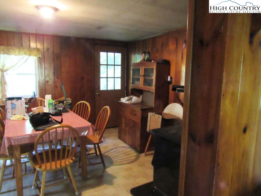 458 Paul Goodman Road Fleetwood, NC 28626 - Photo 17 of 22 a view of a dining room with furniture window and outside view
