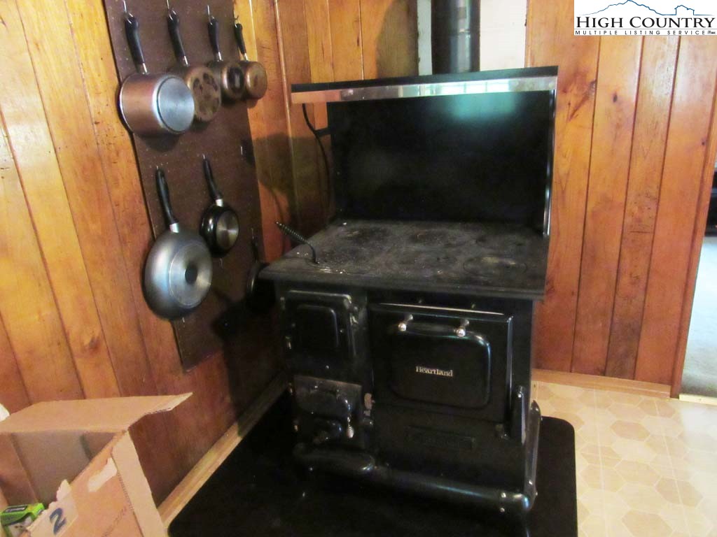 458 Paul Goodman Road Fleetwood, NC 28626 - Photo 18 of 22 a living room with furniture and a flat screen tv