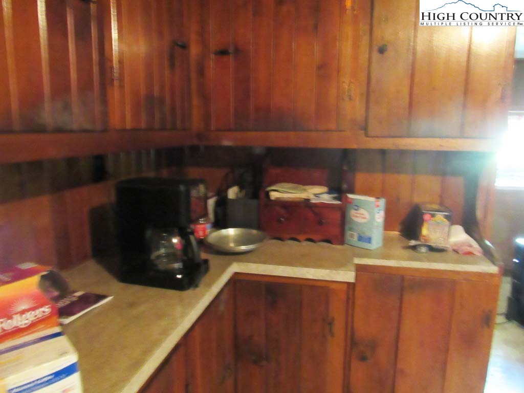 458 Paul Goodman Road Fleetwood, NC 28626 - Photo 19 of 22 a kitchen with a stove and a refrigerator