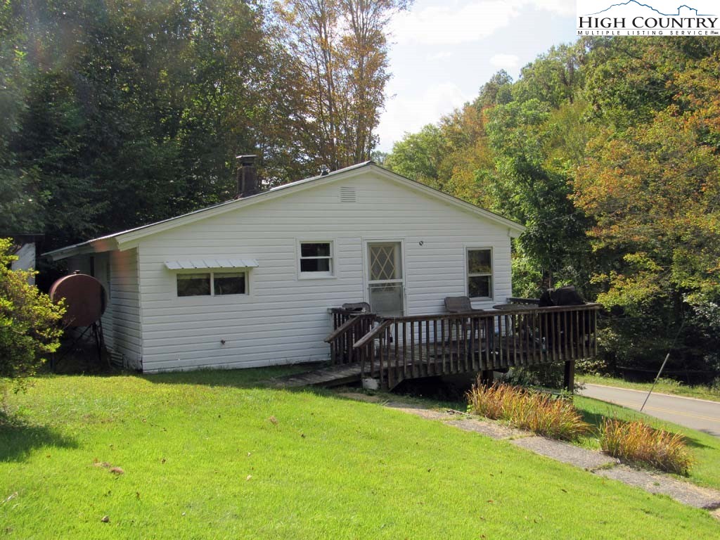 458 Paul Goodman Road Fleetwood, NC 28626 - Photo 2 of 22 a view of a house with a yard and a garden