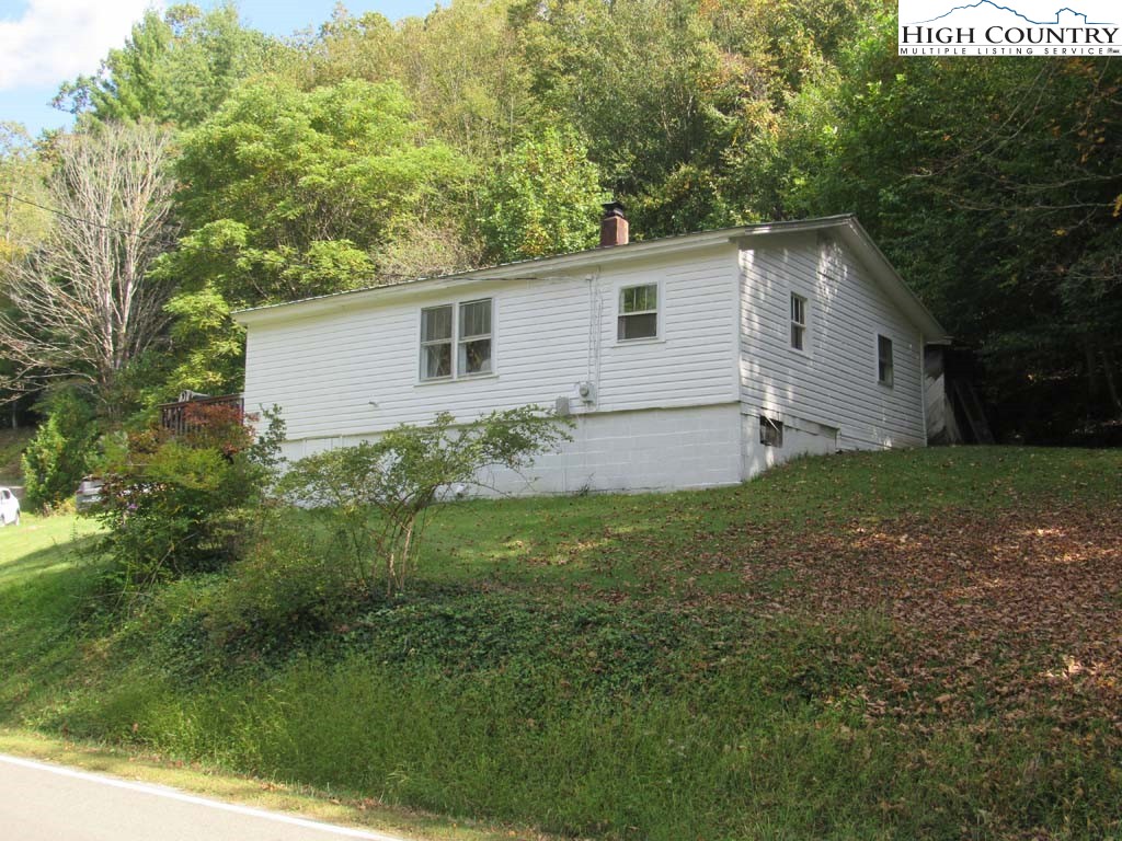 458 Paul Goodman Road Fleetwood, NC 28626 - Photo 4 of 22 a view of a backyard with large trees