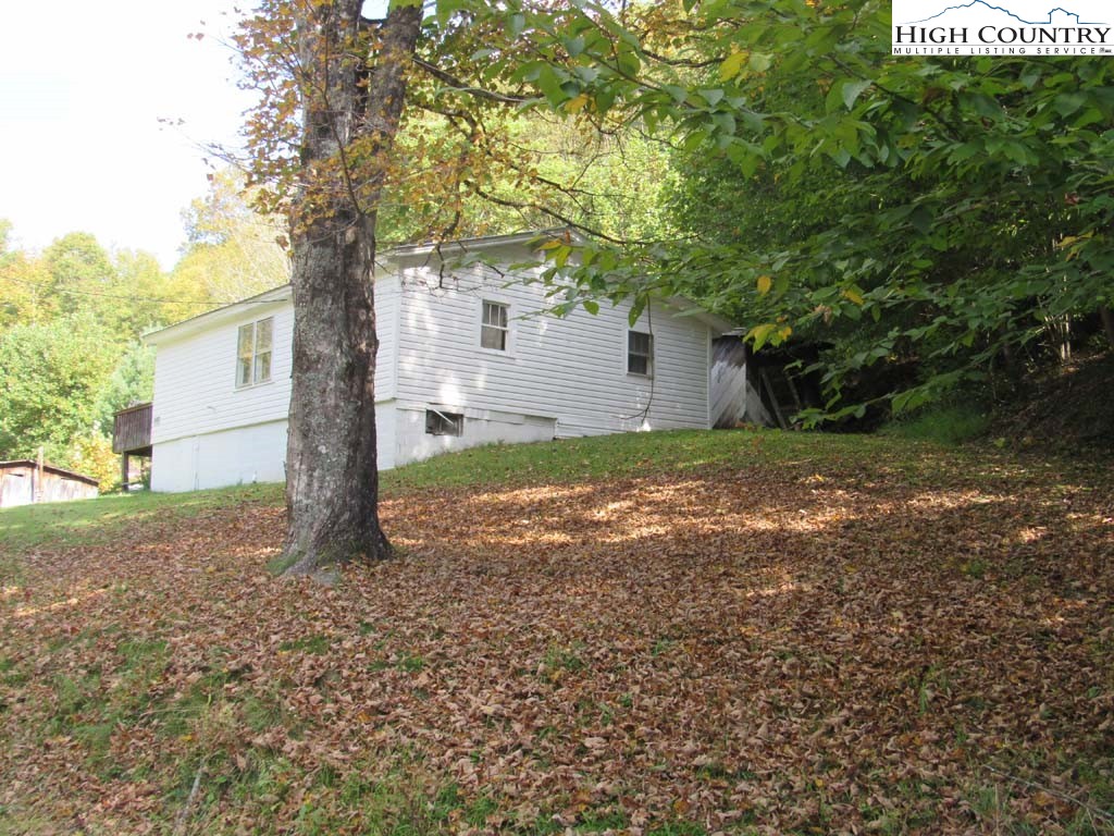 458 Paul Goodman Road Fleetwood, NC 28626 - Photo 6 of 22 a view of a house with a tree in the yard