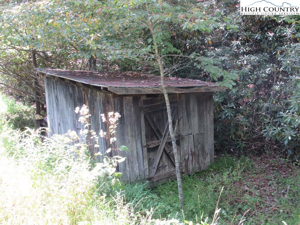 458 Paul Goodman Road Fleetwood, NC 28626 - Photo 8 of 22 a backyard of a house with lots of green space