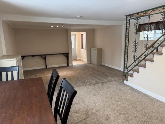 824 12th Street North Virginia, MN 55792 - Photo 11 of 34 Unfurnished dining area featuring carpet floors and ornamental molding