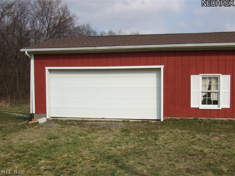 7317 Chestnut-Ridge Road Masury, OH 44438 - Photo 14 of 15 2 car door makes access to this building easy for cars or large projects.