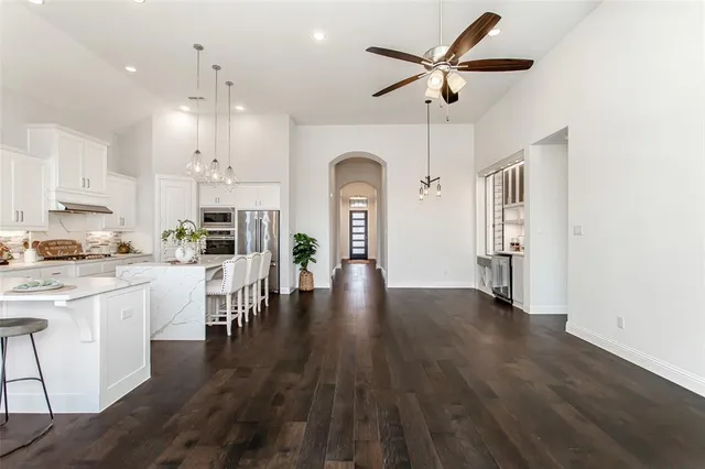 a view of a dining room with furniture and wooden floor