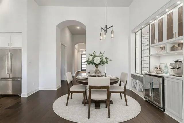 a living room with furniture a large window and a fireplace