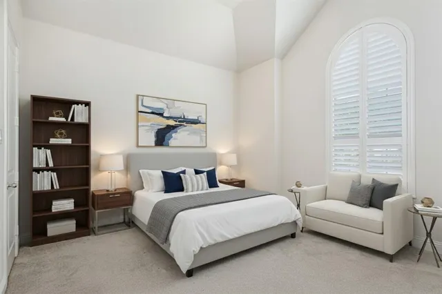 a bedroom with a bed and a couch