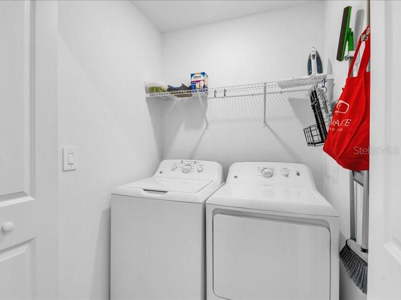 19116 Scallop Loop, Unit 303 Lakewood Ranch, FL 34211 - Photo 29 of 32 a utility room with dryer and washer