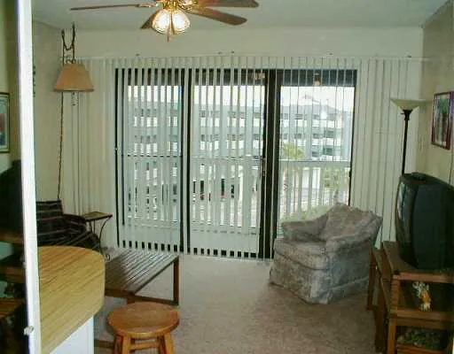 a balcony with furniture and a chandelier