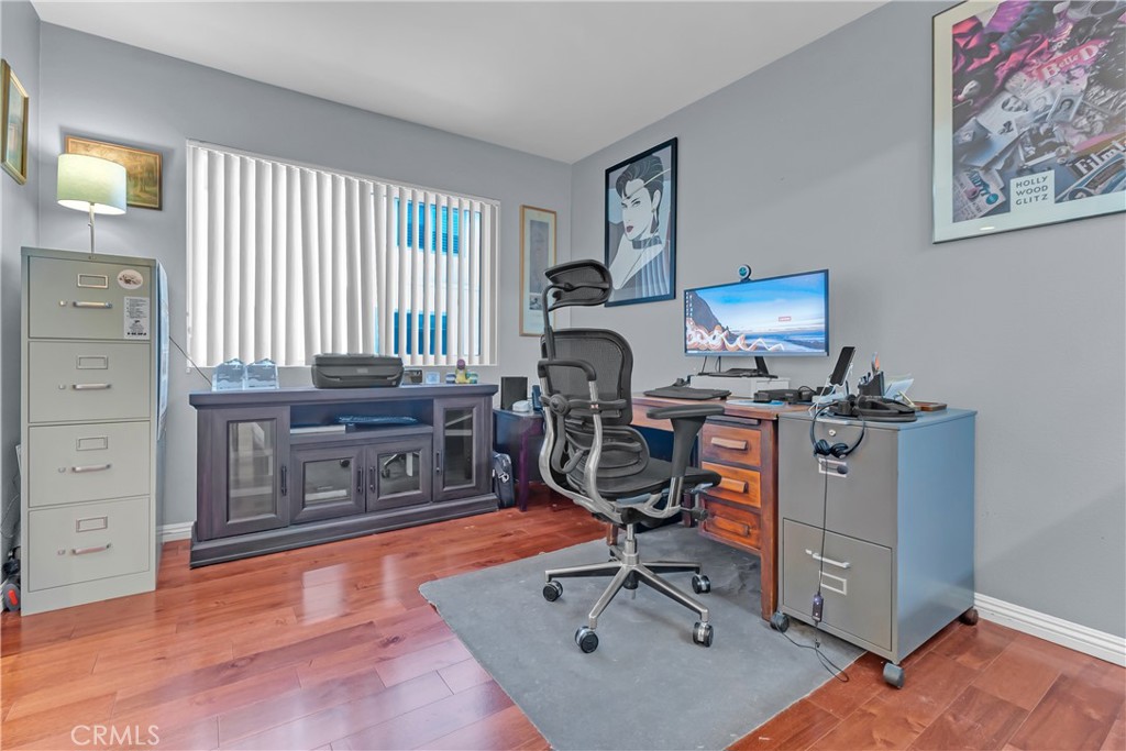 12334 Chandler Boulevard, Unit C Valley Village, CA 91607 - Photo 11 of 30 a view of a workspace with furniture and a window
