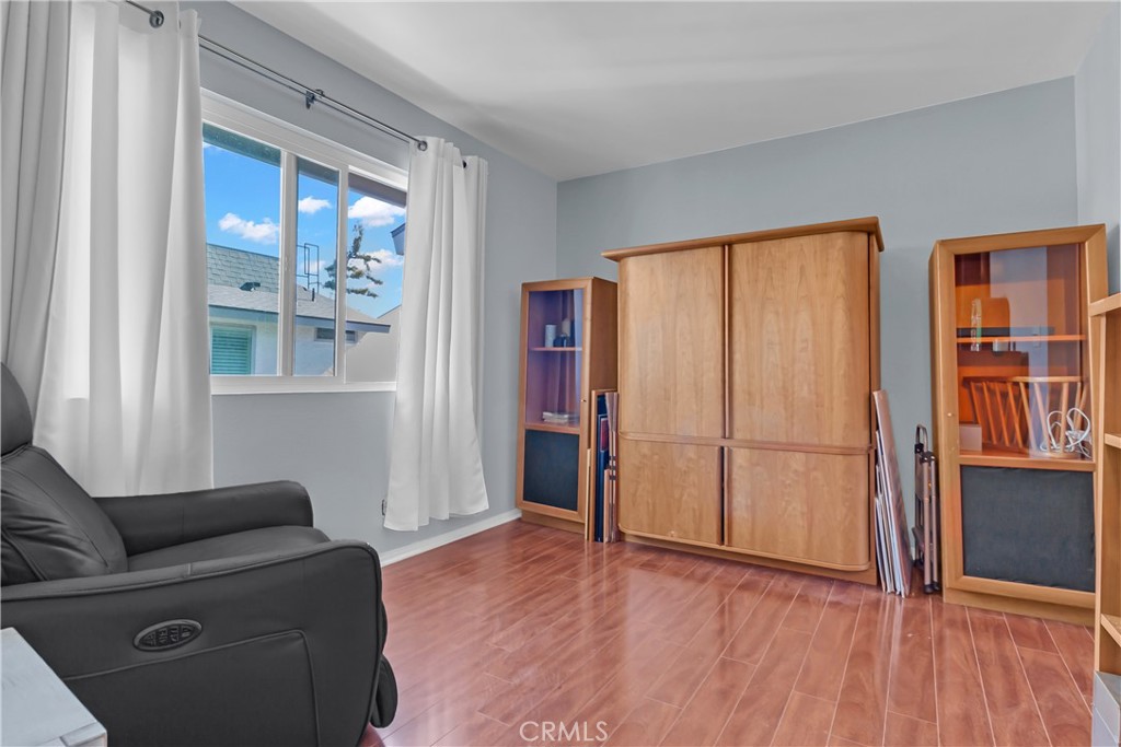 12334 Chandler Boulevard, Unit C Valley Village, CA 91607 - Photo 12 of 30 a living room with furniture and wooden floor