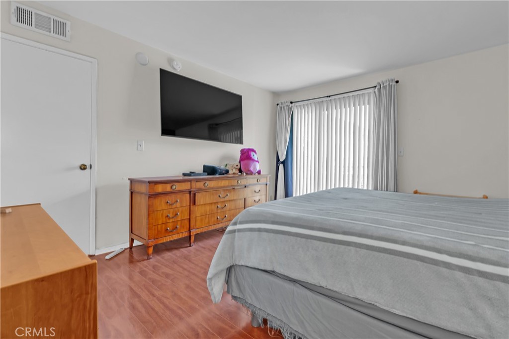 12334 Chandler Boulevard, Unit C Valley Village, CA 91607 - Photo 13 of 30 a bedroom with a bed and a flat screen tv