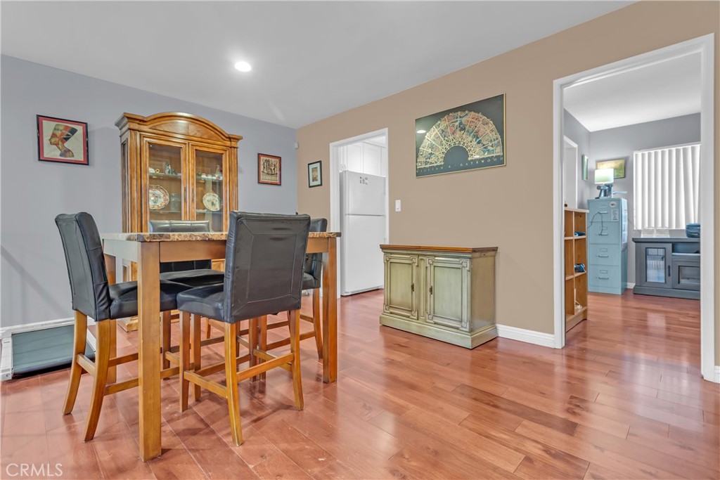 12334 Chandler Boulevard, Unit C Valley Village, CA 91607 - Photo 15 of 30 a view of a dining room with furniture and wooden floor