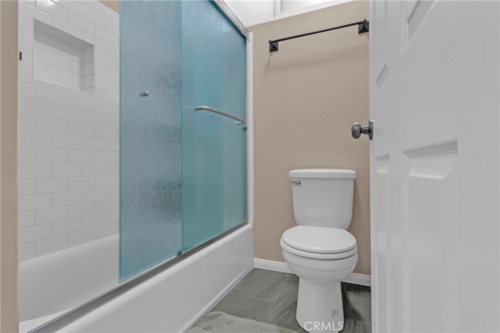 12334 Chandler Boulevard, Unit C Valley Village, CA 91607 - Photo 17 of 30 a bathroom with a toilet and a shower