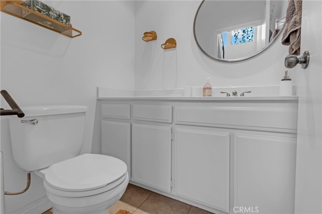 12334 Chandler Boulevard, Unit C Valley Village, CA 91607 - Photo 19 of 30 a bathroom with a toilet and a mirror