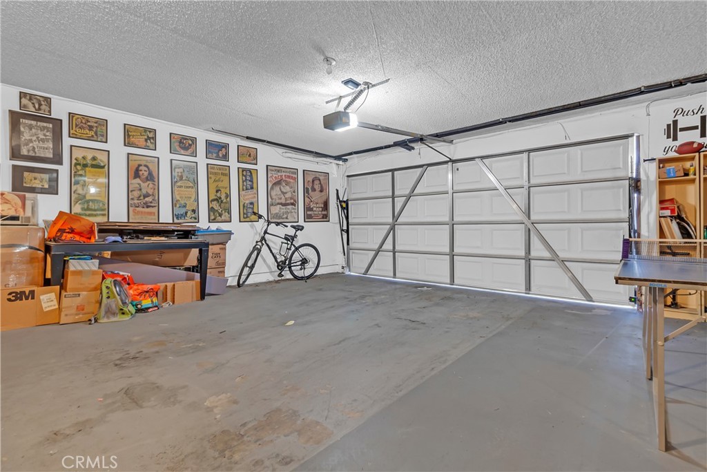 12334 Chandler Boulevard, Unit C Valley Village, CA 91607 - Photo 21 of 30 a view of a garage with table and chairs