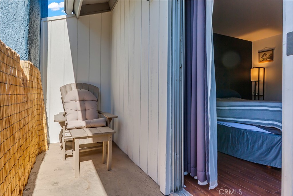 12334 Chandler Boulevard, Unit C Valley Village, CA 91607 - Photo 25 of 30 a chair and table in a balcony
