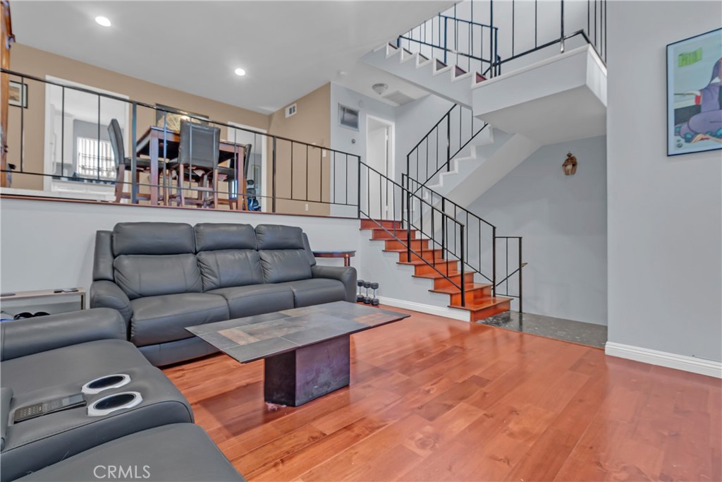 12334 Chandler Boulevard, Unit C Valley Village, CA 91607 - Photo 3 of 30 a living room with furniture and wooden floor
