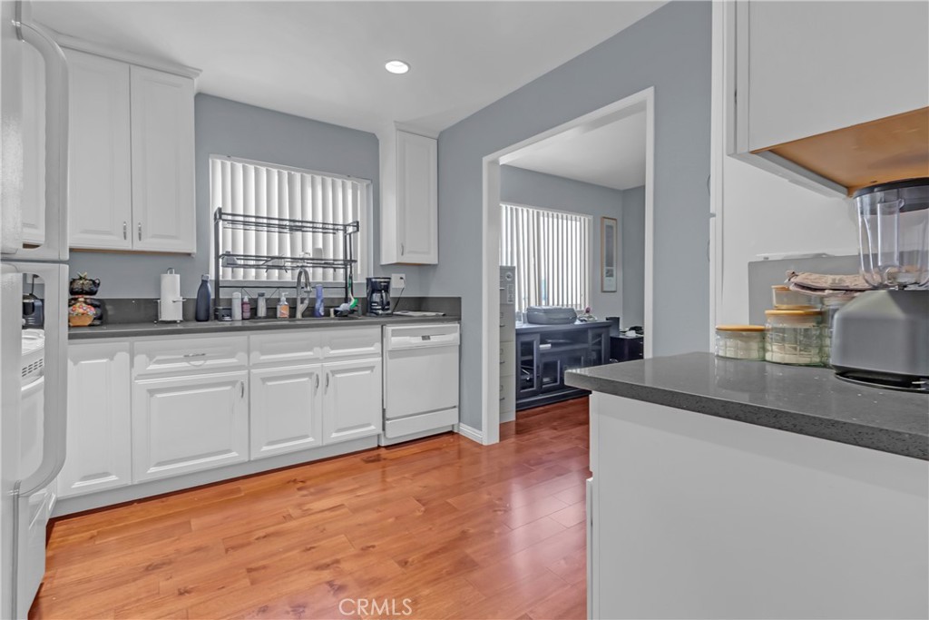 12334 Chandler Boulevard, Unit C Valley Village, CA 91607 - Photo 8 of 30 a kitchen with sink cabinets and window
