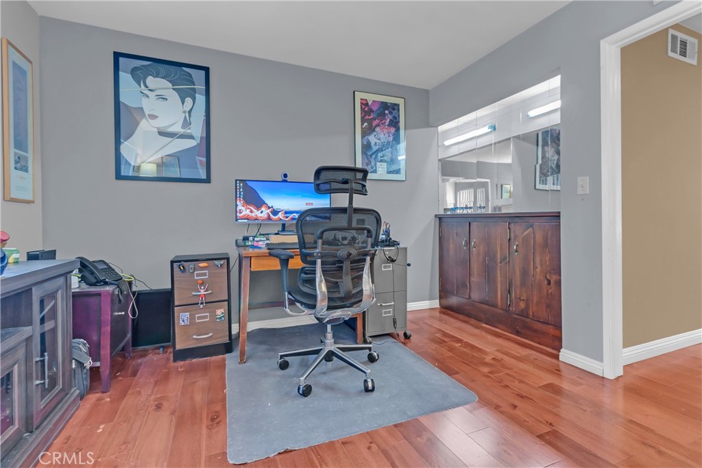 12334 Chandler Boulevard, Unit C Valley Village, CA 91607 - Photo 10 of 30 a view of a workspace with furniture and wooden floor