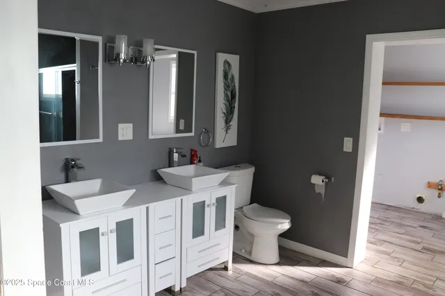 a bathroom with a sink and mirror
