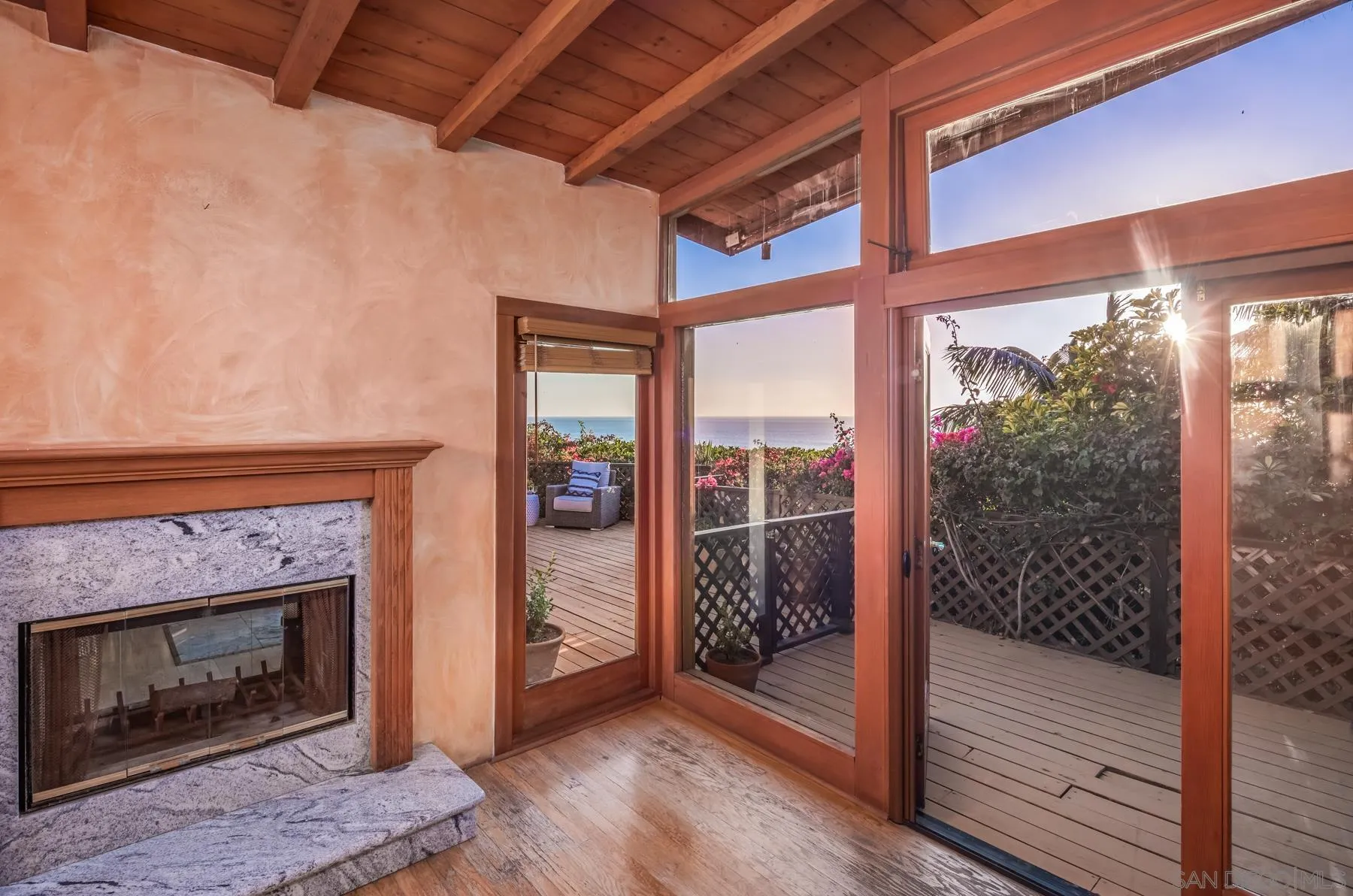110 8th Street Del Mar, CA 92014 - Photo 13 of 24 a view of a livingroom with a fireplace and window