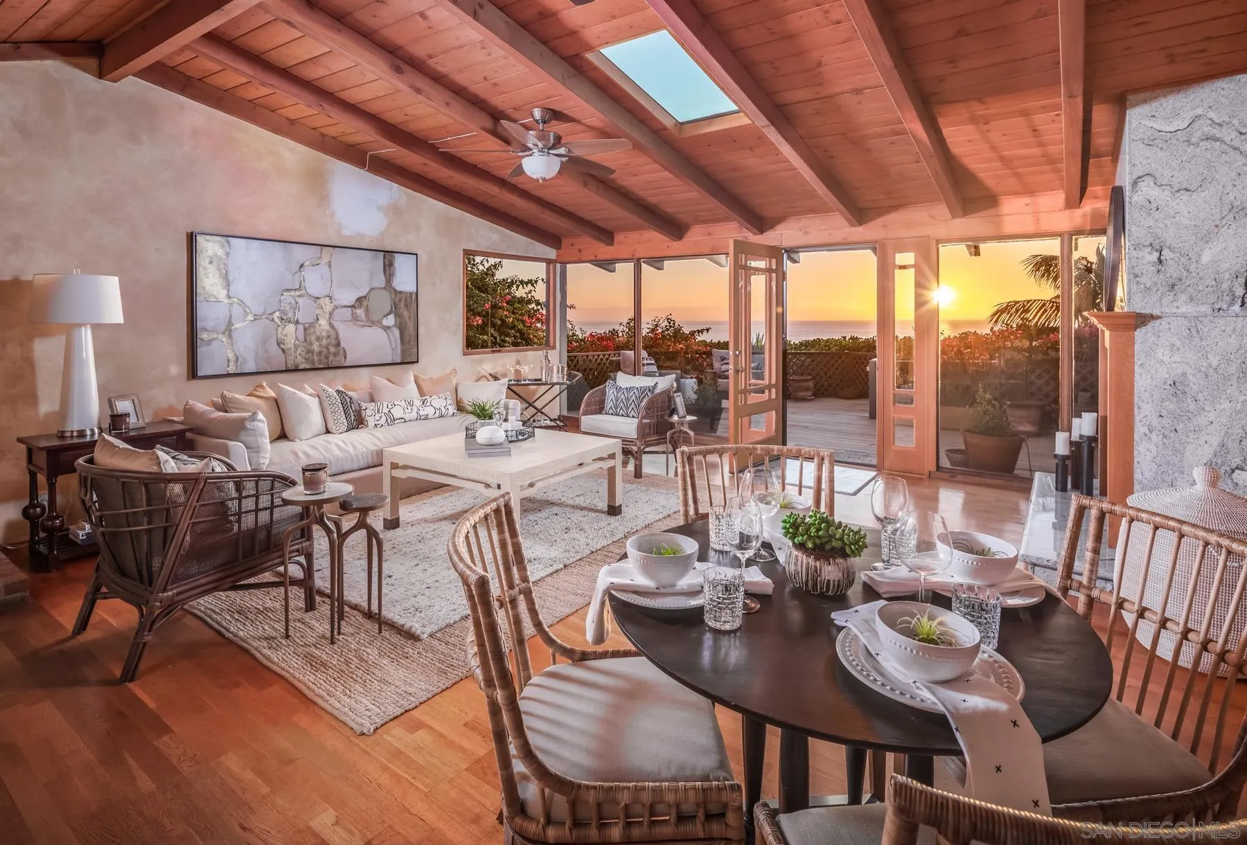 110 8th Street Del Mar, CA 92014 - Photo 10 of 24 a view of a dining room with furniture large windows and wooden floor