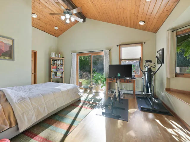 a bed room with a bed and a chair