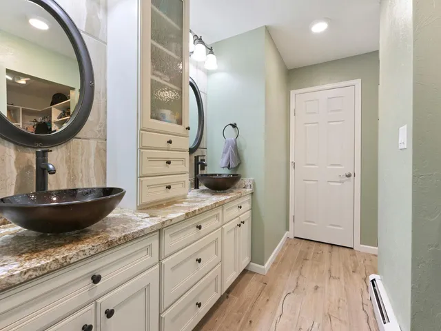a bathroom with a glass shower door
