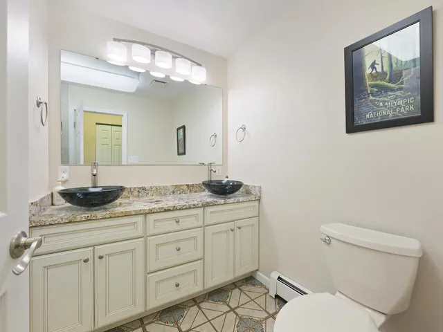 a spacious bedroom with a bed and a window