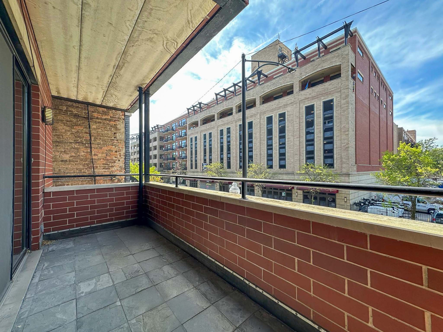 1332 West Madison Street, Unit 2E Chicago, IL 60607 - Photo 11 of 26 a view of balcony with couple of cars