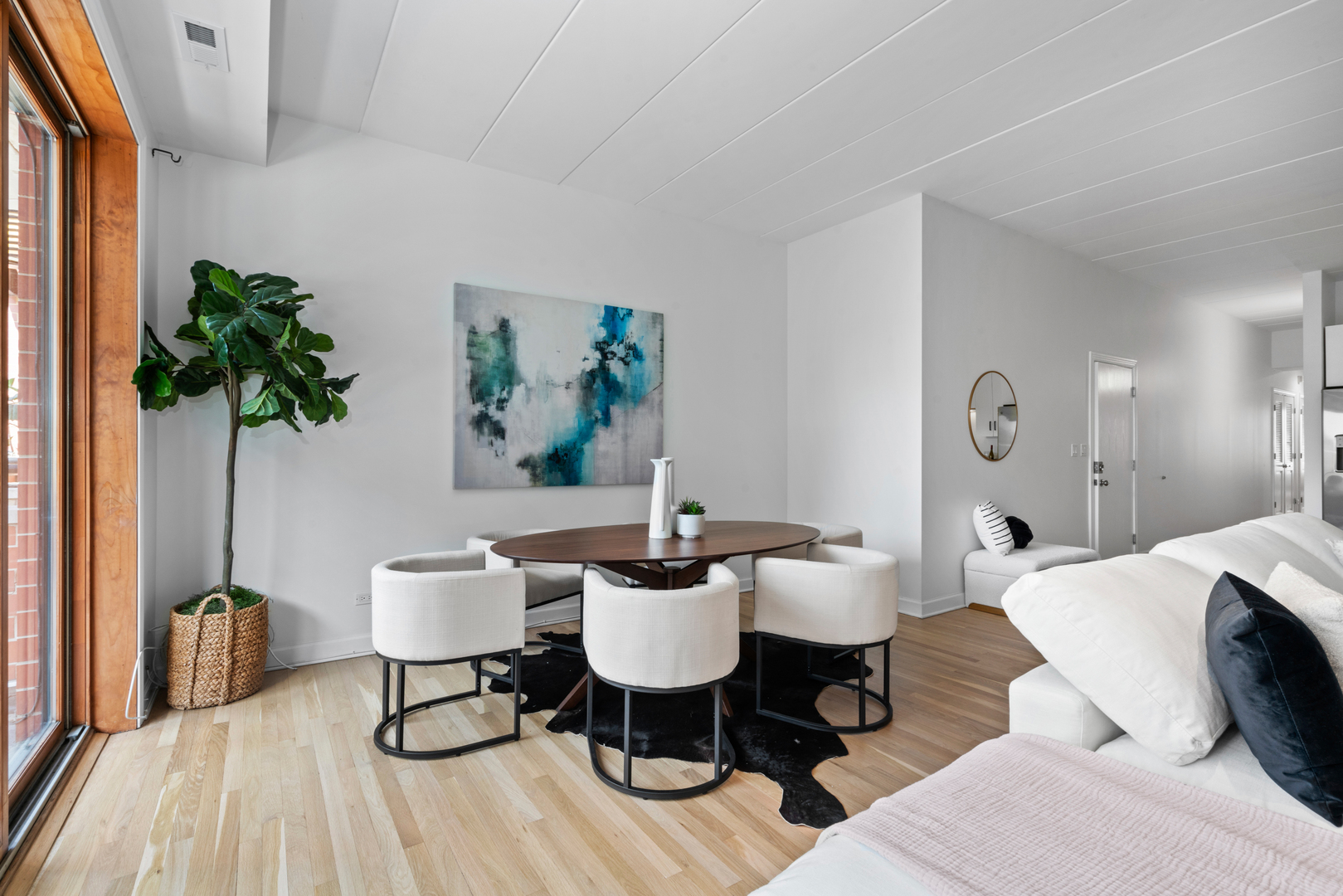 1332 West Madison Street, Unit 2E Chicago, IL 60607 - Photo 12 of 26 a living room with furniture and a potted plant