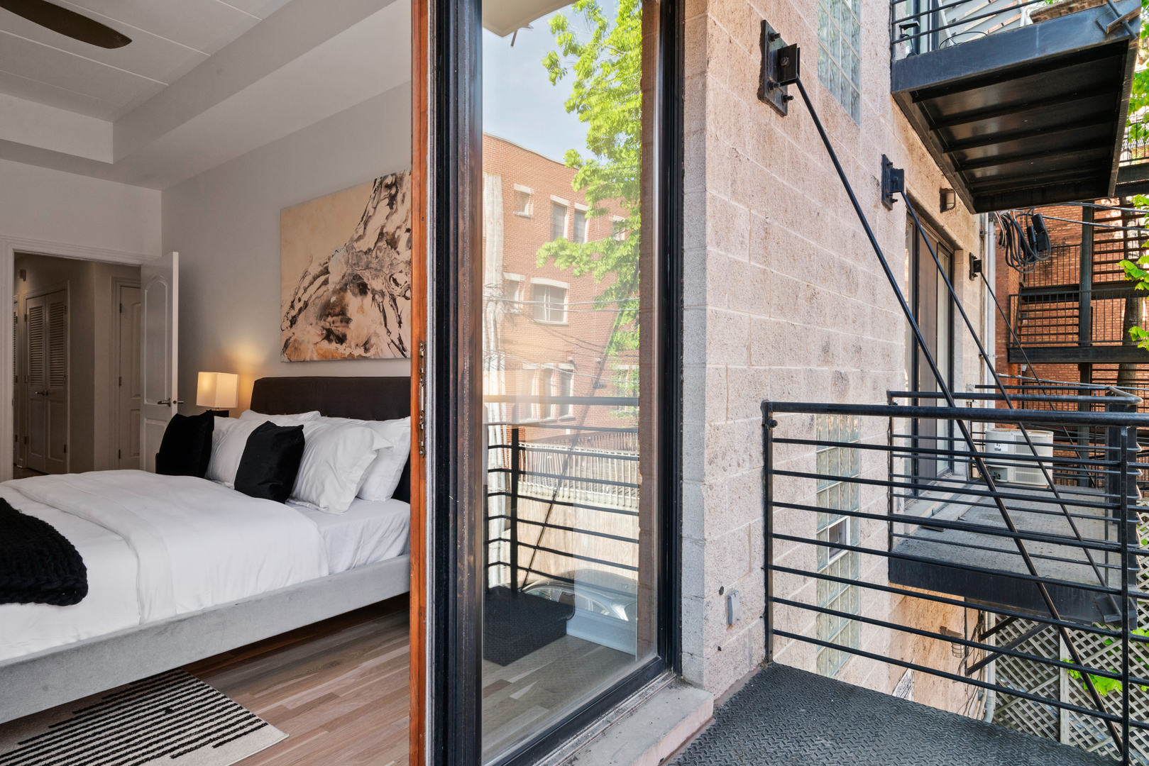 1332 West Madison Street, Unit 2E Chicago, IL 60607 - Photo 15 of 26 a bedroom with a bed and a window