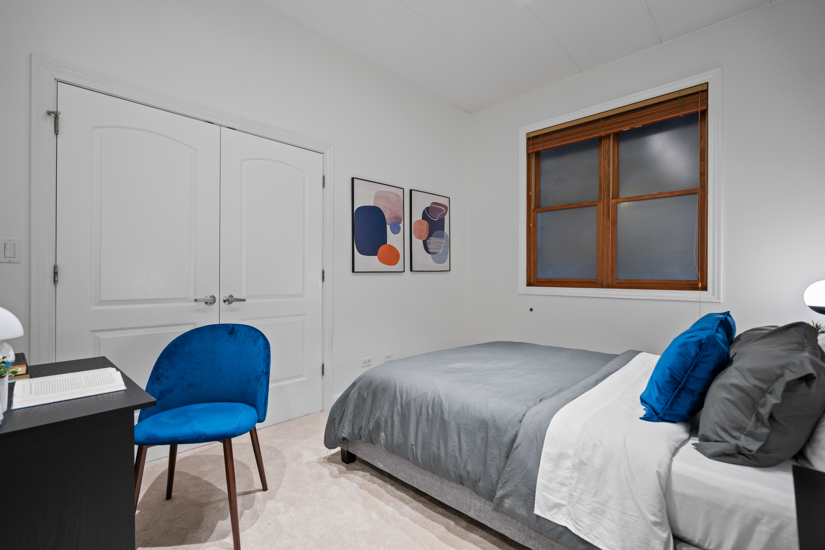 1332 West Madison Street, Unit 2E Chicago, IL 60607 - Photo 23 of 26 a bedroom with a bed a chair and painting on the wall