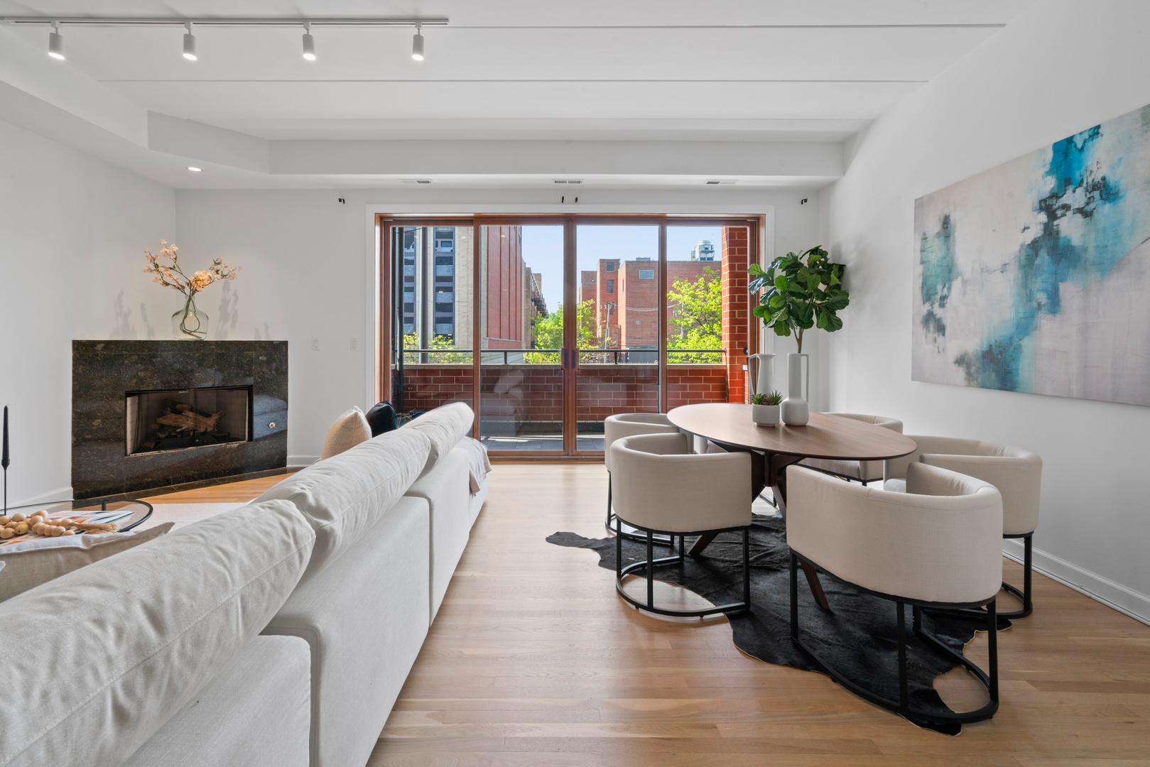 1332 West Madison Street, Unit 2E Chicago, IL 60607 - Photo 9 of 26 a living room with furniture and a fireplace