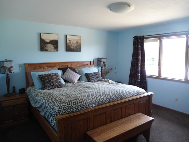 10280 Branch Road Rochelle, IL 61068 - Photo 10 of 17 a bed sitting in a bedroom next to a window