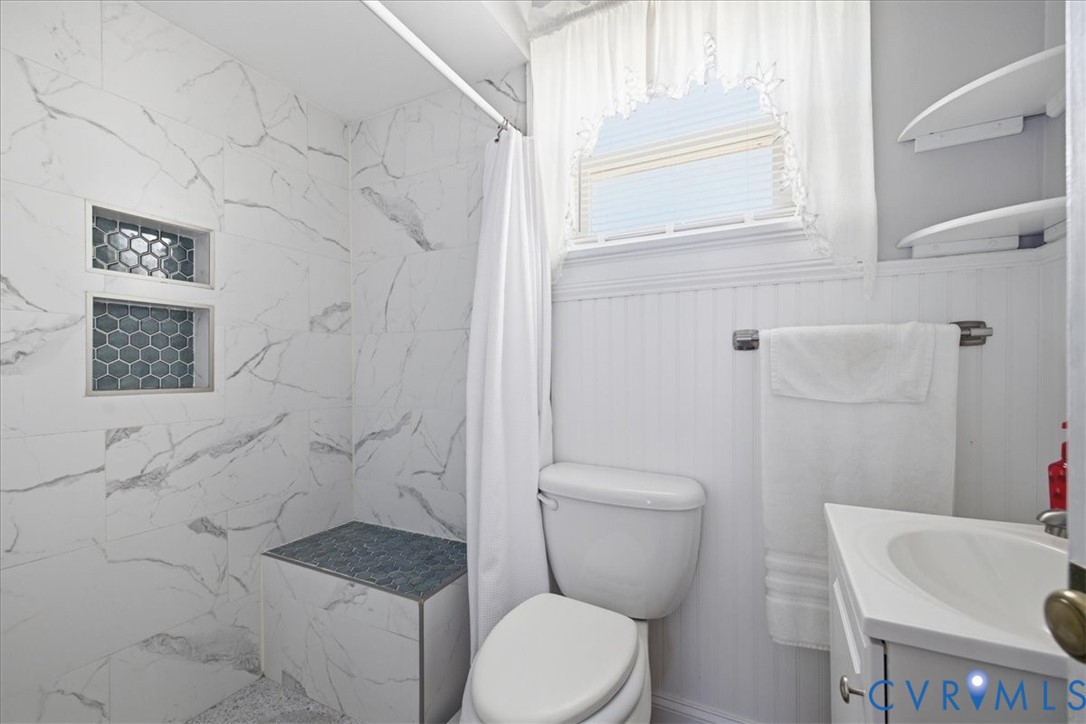 216 Conduit Road Colonial Heights, VA 23834 - Photo 20 of 26 Walk-in shower with marble-look tile, built-in she