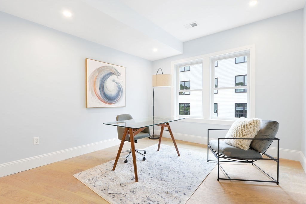 21 Glen Road, Unit 7 Boston, MA 02130 - Photo 11 of 15 a living room with furniture a rug and a window