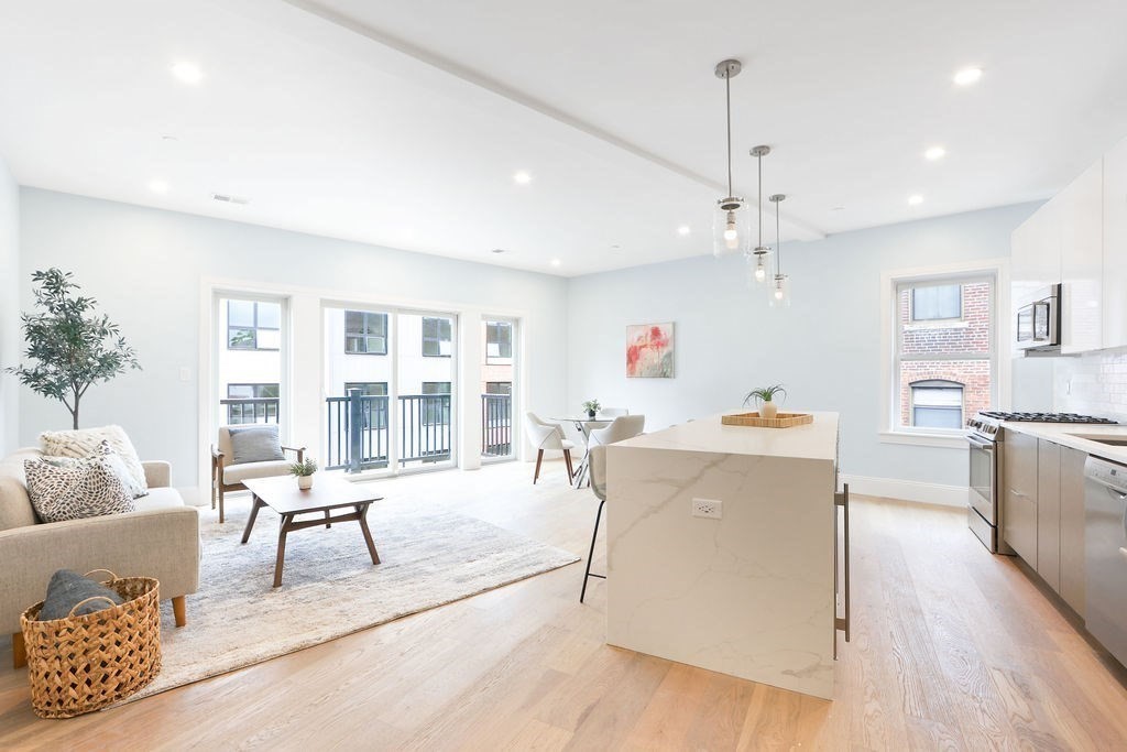 21 Glen Road, Unit 7 Boston, MA 02130 - Photo 4 of 15 a living room with furniture and kitchen view