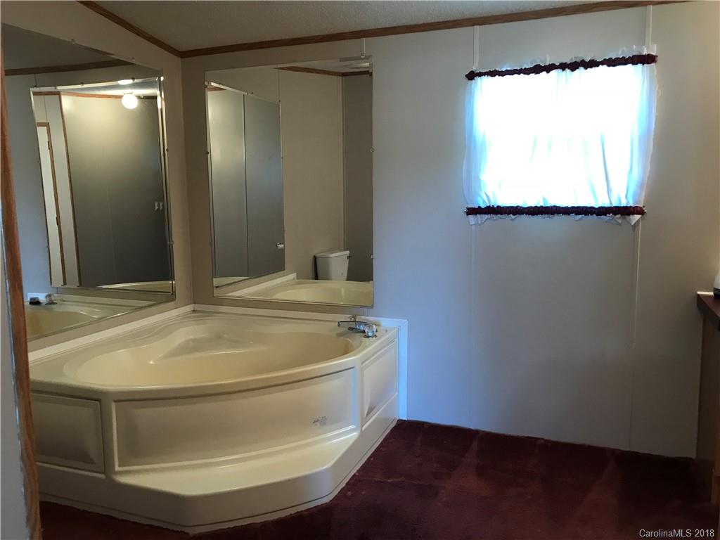 5730 East Bandys Cross Road Catawba, NC 28609 - Photo 14 of 21 a bathroom with a sink and a mirror