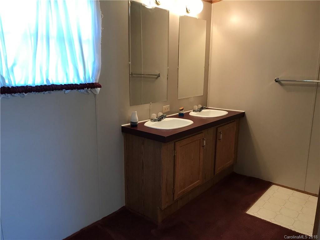 5730 East Bandys Cross Road Catawba, NC 28609 - Photo 15 of 21 a bathroom with a sink and a mirror