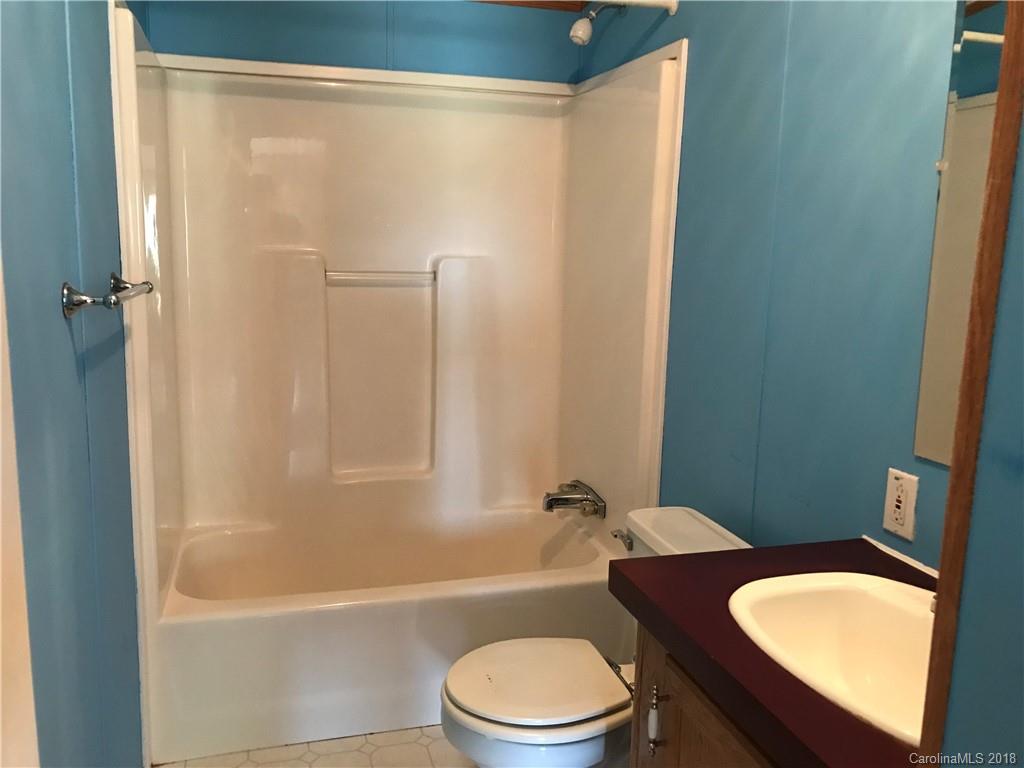 5730 East Bandys Cross Road Catawba, NC 28609 - Photo 18 of 21 a bathroom with a toilet a sink and bathtub