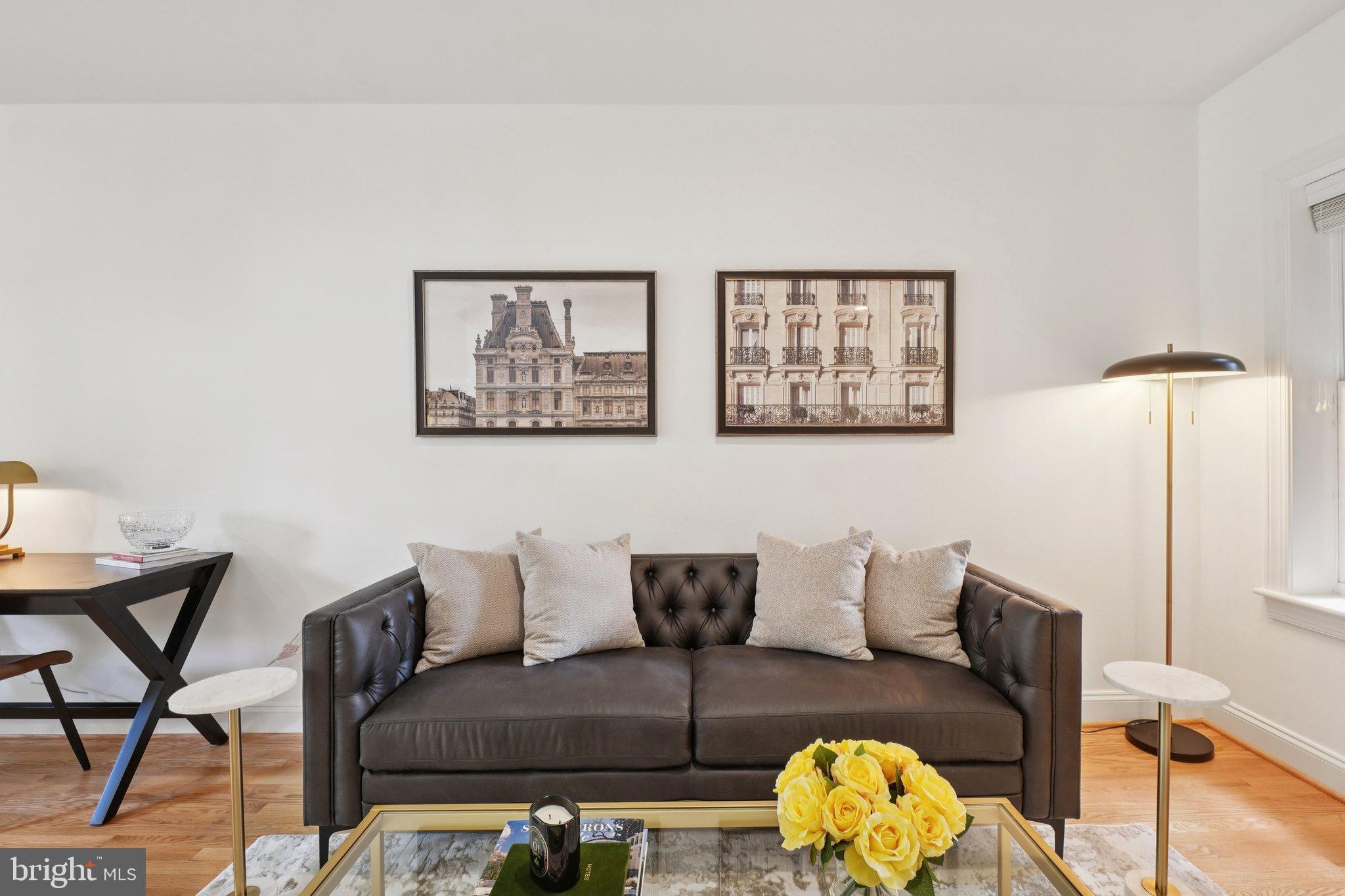 1840 Vernon Street Northwest, Unit 208 Washington, DC 20009 - Photo 13 of 26 a living room with furniture and wooden floor